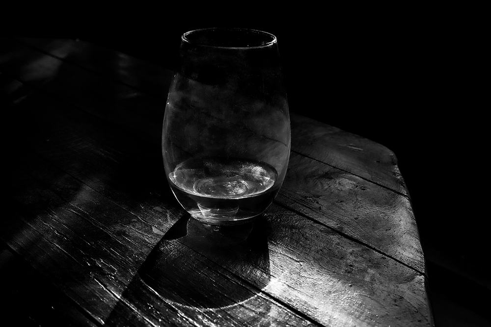 Travelling winter light shining through a glass of Viognier.